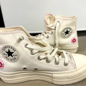 Converse Chuck Taylor All Star high lift embroidered canvas platform sneakers.